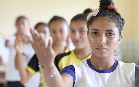 Young women practice a school play that recalls their troubled history in the Escola São João in Quilombo Tiningu, near Santarém, Brazil. 