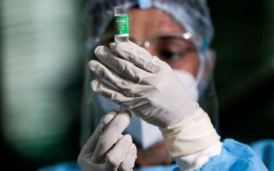 A health official draws a dose of AstraZeneca's COVID-19 vaccine at Infectious Diseases Hospital Jan. 29 in Colombo, Sri Lanka. (CNS/Dinuka Liyanawatte, Reuters)