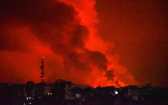 Smoke rises from the volcanic eruption of Mount Nyiragongo near Goma, Congo, May 22. (CNS/Reuters/Olivia Acland)