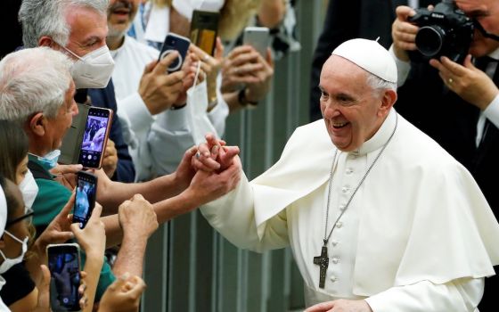 Pope Francis greets people during an event marking the 50th anniversary of the founding of Caritas Italy, at the Vatican June 26. (CNS/Reuters/Remo Casilli)