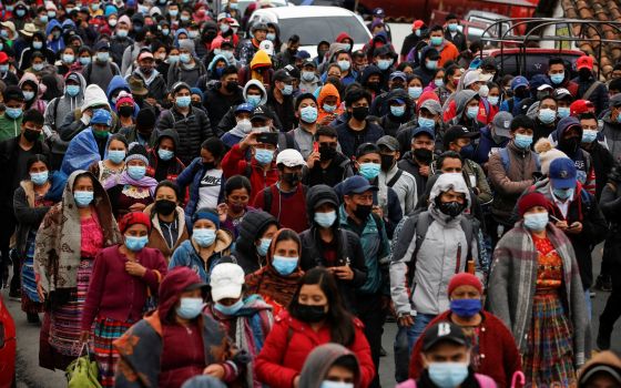 Guatemalans march during a protest demanding the resignation of President Alejandro Giammattei and Attorney General María Consuelo Porra in San Cristobal Totonicapan July 29, 2021. (CNS photo/Luis Echeverria, Reuters)