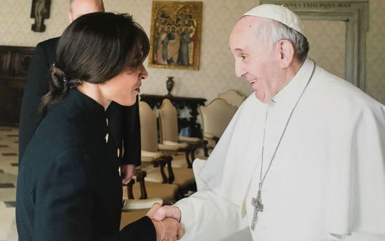 Argentine theologian Emilce Cuda is pictured with the pope at the Vatican March 17, 2017. (CNS/Vatican Media)