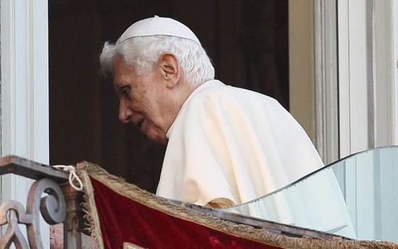 Pope Benedict XVI walks away after his final public appearance as pope in Castel Gandolfo, Italy, Feb. 28, 2013. (CNS/Paul Haring)