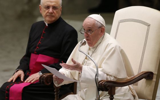 Pope Francis leads his general audience in the Paul VI hall at the Vatican Sept. 8, 2021. At left is Msgr. Leonardo Sapienza, an official of the Prefecture of the Papal Household. (CNS photo/Paul Haring)