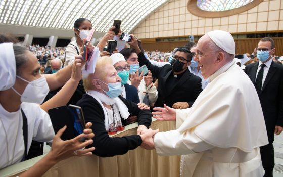 Pope Francis greets people during an audience with the faithful from the Diocese of Rome at the Vatican Sept. 18, 2021. (CNS photo/Vatican Media)