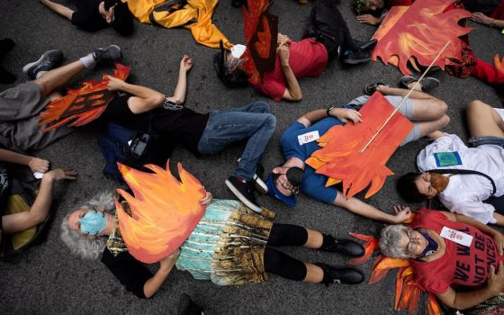 People in New York City block a street in Manhattan pretending to be dead during a Sept. 17 climate change protest. (CNS photo/Caitlin Ochs, Reuters)