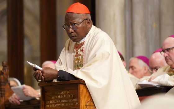 Cardinal Philippe Ouédraogo of Ouagadougou, Burkina Faso, kneels in the sanctuary at St. Patrick's Cathedral in New York City Dec. 10, 2019. (CNS photo/Gregory A. Shemitz)