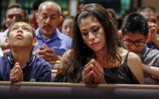 People in Nashville, Tenn., pray during the litany of saints at a Mass for the dedication of Sagrado Corazon Church in this 2016 file photo. (CNS photo/Rick Musacchio, Tennessee Register)