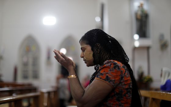 A woman is pictured in a file photo praying at St. Anthony Church in Yangon, Myanmar, Nov. 28, 2017. (CNS photo/Jorge Silva, Reuters)