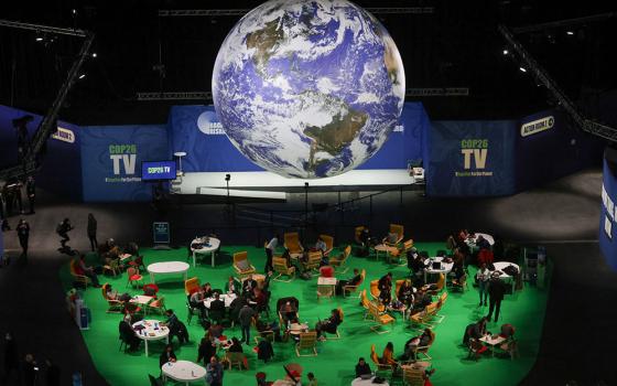 People attend the U.N. Climate Change Conference in Glasgow, Scotland, Nov. 12. (CNS/Reuters/Yves Herman)