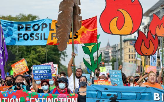 Young environmental activists march to the U.S. Capitol during a climate change protest in Washington, D.C., Oct. 15, 2021. Members of Gen Z, people born after 1996, generally consider climate change an existential crisis. (CNS/Reuters/Evelyn Hockstein)