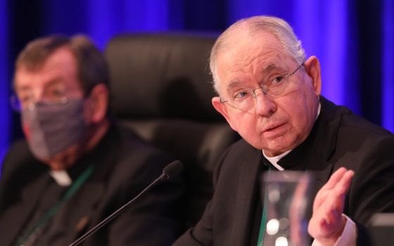 Archbishop José Gomez of Los Angeles, president of the U.S. Conference of Catholic Bishops, gestures alongside Detroit Archbishop Allen Vigneron, vice president, during a Nov. 17 session of the bishops' fall general assembly in Baltimore. (CNS/Bob Roller)