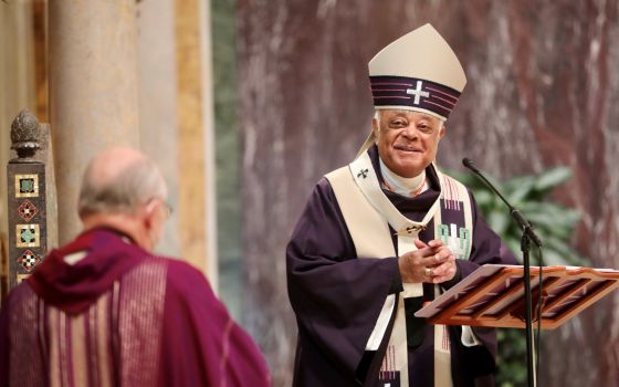 Washington Cardinal Wilton D. Gregory is congratulated after Mass Nov. 28, 2021, by Msgr. W. Ronald Jameson, rector at the Cathedral of St. Matthew. (CNS photo/Andrew Biraj, Catholic Standard)