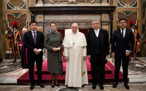 Pope Francis is pictured with new ambassadors to the Holy See during an audience with ambassadors from Moldova, Kyrgyzstan, Namibia, Lesotho, Luxembourg, Chad and Guinea-Bissau, at the Vatican Dec. 17, 2021. (CNS photo/Vatican Media)