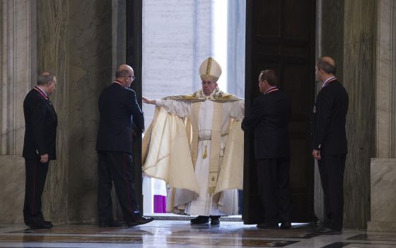 In this 2015 file photo, Pope Francis opens the Holy Door of St. Peter's Basilica to inaugurate the Jubilee Year of Mercy at the Vatican. (CNS photo/L'Osservatore Romano, handout)