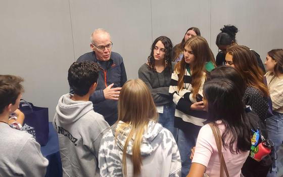 Environmental activist and writer Bill McKibben talks with attendees after a breakout session at the 25th annual Ignatian Family Teach-In for Justice on Oct. 22 in Washington, D.C. (EarthBeat photo/Brian Roewe)