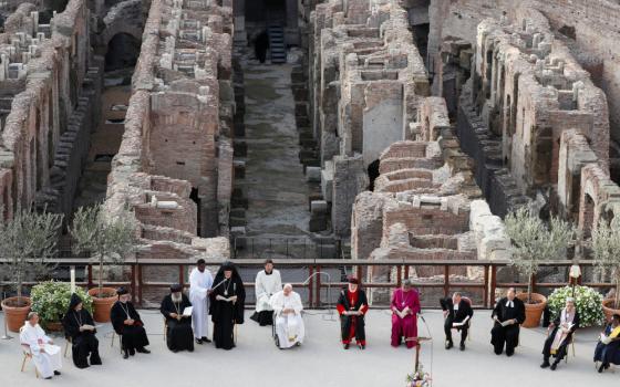 Pope Francis presides over a prayer for peace with other Christian leaders inside Rome's Colosseum before joining other religious leaders launching an appeal for peace Oct. 25, 2022. (CNS photo/Remo Casilli, Reuters)