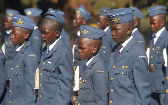 In this June 16, 2018, photo, boys dressed in Air Force uniforms stand during celebrations to mark the Day of the African Child in Harare, Zimbabwe. Day of the African Child is celebrated on June 16 every year to commemorate the 1976 uprising in Soweto, South Africa. (AP/Tsvangirayi Mukwazhi)