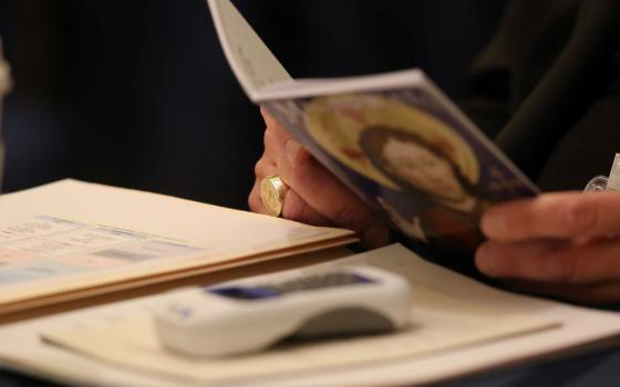 hands are seen holding a bookl