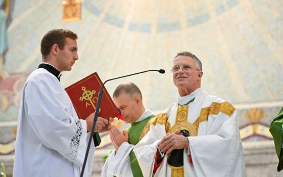 Archbishop Timothy Broglio of the U.S. Archdiocese for the Military Services greets a U.S. Naval Academy cadet midshipman after the annual Sea Services Pilgrimage Mass at the National Shrine of St. Elizabeth Ann Seton in Emmitsburg, Md., Oct. 2, 2022. (CNS/Jason Minick, courtesy of Devine Partners)