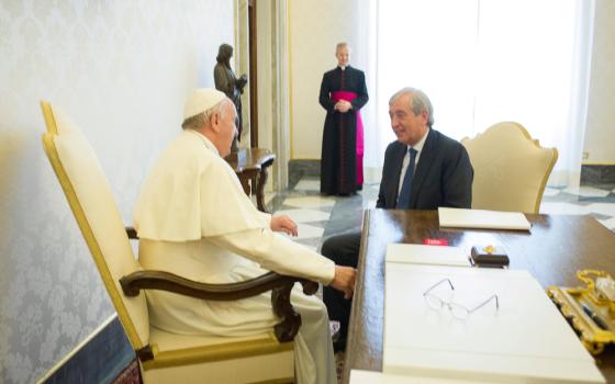 Pope Francis meets Libero Milone, then the Vatican's auditor general, at the Vatican April 1, 2016. 