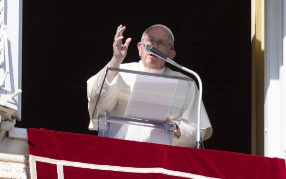 Pope Francis leads the recitation of the Angelus from a window of the Apostolic Palace at the Vatican Nov. 1, 2022, the feast of All Saints.