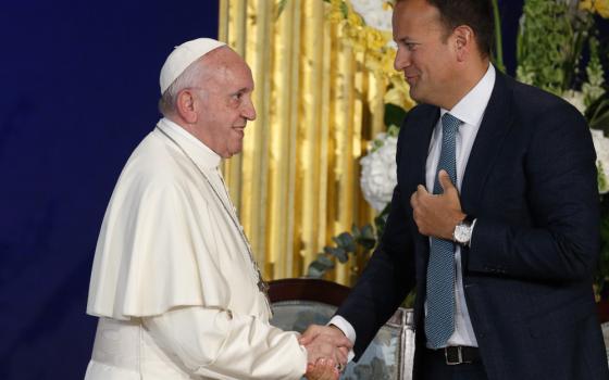 Pope Francis greets Leo Varadkar, then prime minister of Ireland, during a meeting with authorities, civil society leaders and members of the diplomatic corps in Dublin Castle in Dublin Aug. 25, 2018.