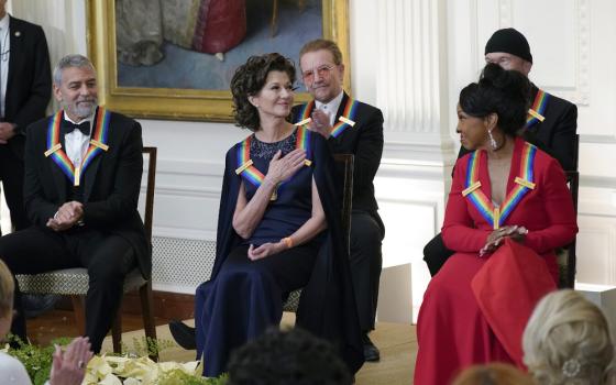 Contemporary Christian singer Amy Grant, center, reacts as she is recognized by President Joe Biden during the Kennedy Center honorees reception at the White House in Washington, Dec. 4. The 2022 Kennedy Center Honorees include from left, George Clooney, Amy Grant, Bono, Gladys Knight, and The Edge. (AP/Manuel Balce Ceneta)