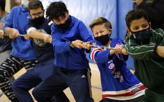 Students compete in a game of tug of war Feb. 1, 2022, at St. Patrick School in Smithtown, N.Y. The event was one of many special activities scheduled by the school to celebrate Catholic Schools Week. (CNS photo/Gregory A. Shemitz)