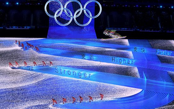 Performers are pictured under the Olympic rings during the opening ceremony of the Winter Olympics at National Stadium in Beijing Feb. 4. (CNS/Reuters/Toby Melville)