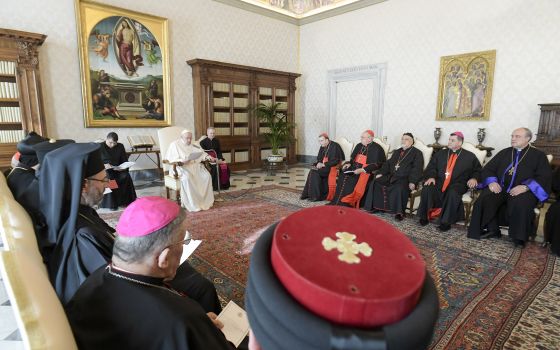 Pope Francis met with an ecumenical group of Christian leaders from Iraq in the library of the Vatican's Apostolic Palace Feb. 28, 2022. (CNS photo/Vatican Media)