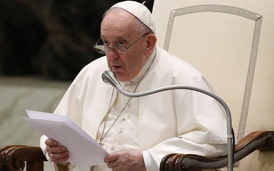 Pope Francis recites a prayer, "Forgive us for the war, Lord," composed by Italian Archbishop Domenico Battaglia of Naples, during his general audience in the Paul VI hall March 16 at the Vatican. (CNS/Paul Haring)