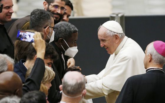 Pope Francis greets priests during an audience with Missionaries of Mercy priests at the Vatican April 25, 2022. (CNS photo/Paul Haring)