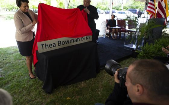 Washington Cardinal Wilton Gregory and Mayor Muriel Bowser of the District of Columbia participate in the dedication and blessing of Sister Thea Bowman Drive on April 29 at the Catholic University of America in Washington. (CNS/Tyler Orsburn)