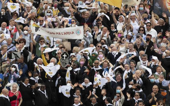 People in St. Peter's Square attend the "Regina Coeli" prayer led by Pope Francis from the window of his studio overlooking the square at the Vatican May 8, 2022. (CNS photo/Vatican Media)