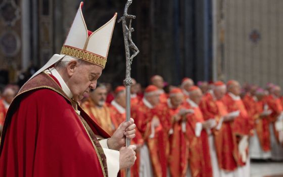 Pope Francis listens as a deacon proclaims the Gospel during Mass in St. Peter's Basilica at the Vatican June 29 for the feast of Sts. Peter and Paul. (CNS/Vatican Media)