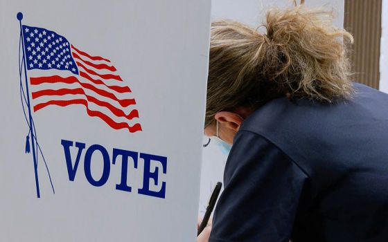 A voter marks a ballot during the primary election and abortion referendum at a Wyandotte County polling station Aug. 2 in Kansas City, Kansas. (CNS/Reuters/Eric Cox)