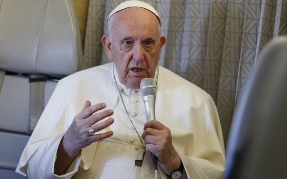 Pope Francis answers questions from journalists aboard his flight from Nur-Sultan, Kazakhstan, to Rome Sept. 15. (CNS/Paul Haring)