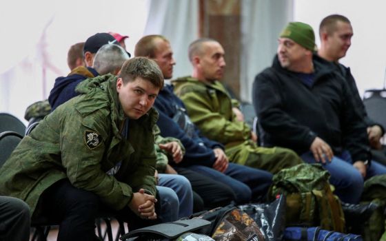 Russian reservists meet at a gathering point in the course of partial mobilization of troops in Volzhsky Sept. 28, 2022. (CNS photo/Reuters)