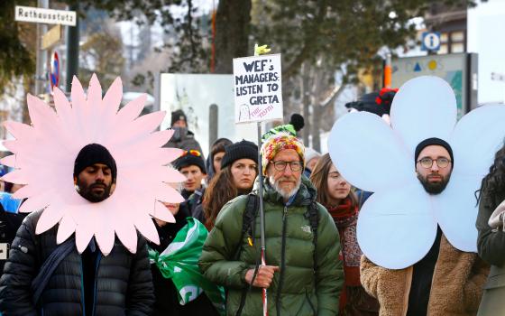 Climate change activists protest during the World Economic Forum annual meeting in Davos, Switzerland, Jan. 21. 