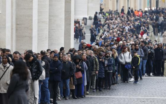 People wait in line to enter St. Peter's Basilica to view the body of Pope Benedict XVI at the Vatican Jan. 2, 2023. (CNS photo/Paul Haring)