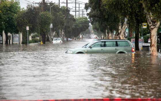 Abandoned cars are seen in a flooded street in east Santa Barbara, Calif., Jan. 9, 2023.