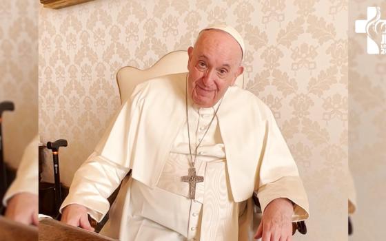 Pope Francis looks to the side in a video screen grab with the Lisboa 2022 World Youth Day logo