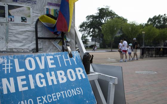 A "Love Thy Neighbor: No Exceptions" sign is seen near the White House July 7, 2021, in Washington. (CNS/Tyler Orsburn)