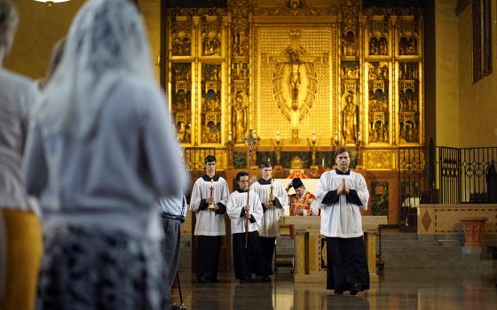 Altar servers lead the closing procession during a Tridentine Mass at Immaculate Conception Seminary in Huntington, New York, on July 1, 2021. (CNS/Gregory A. Shemitz)