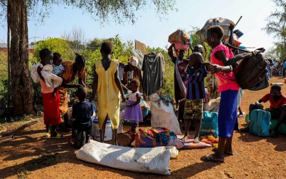 A group of internally displaced people arrive by boat at Malakal riverside seeking safety at the Malakal Protection of Civilians (PoC) site in Upper Nile State, South Sudan, Dec. 3, 2022. (CNS/UNHCR/Charlotte Hallqvist)