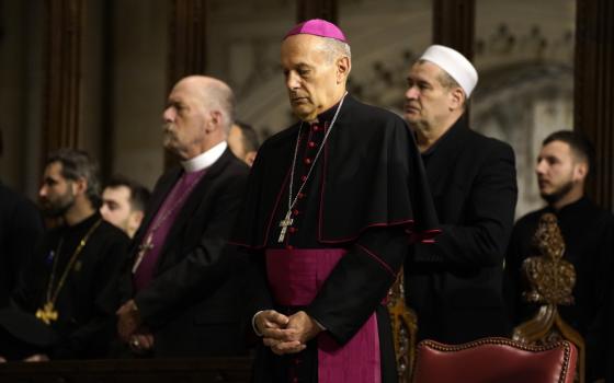 Archbishop Gabriele Caccia, the Vatican's permanent observer to the United Nations, is seen in the sanctuary during an ecumenical prayer service for peace in Ukraine at St. Patrick's Cathedral in New York City Feb. 18, 2023. The archbishop also discussed Ukraine and peacebuilding at the New York Encounter during a Feb. 19 sessions with Ukrainian Catholic Archbishop Borys Gudziak of Philadelphia. (OSV News photo/Gregory A. Shemitz)