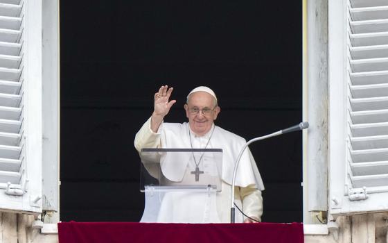 Pope Francis delivers his blessing as he recites the Angelus noon prayer from the window of his studio overlooking St. Peter's Square at the Vatican Feb. 26. (AP/Andrew Medichini)