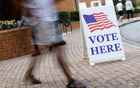 People at the Smyrna Community Center in Smyrna, Georgia, visit an early voting location Nov. 3, 2022, during midterm elections. During their 2022 fall general assembly, the U.S. bishops voted to keep their quadrennial document "Forming Consciences for Faithful Citizenship" and supplement it with inserts, social media components and an introductory note. (CNS/Reuters/Jonathan Ernst)