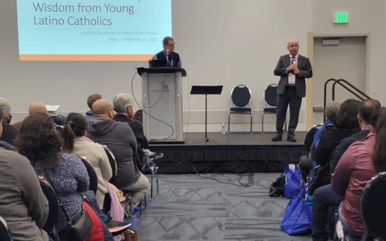 Timothy Matovina, left, and Hosffman Ospino give a workshop on ministry for young Latinos and Latinas during the Los Angeles Religious Education Congress Feb. 25 in Anaheim, California. (NCR photo/Heidi Schlumpf)